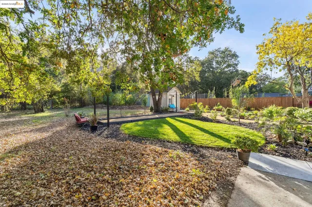 a picture of a room with a white wall and a painting
