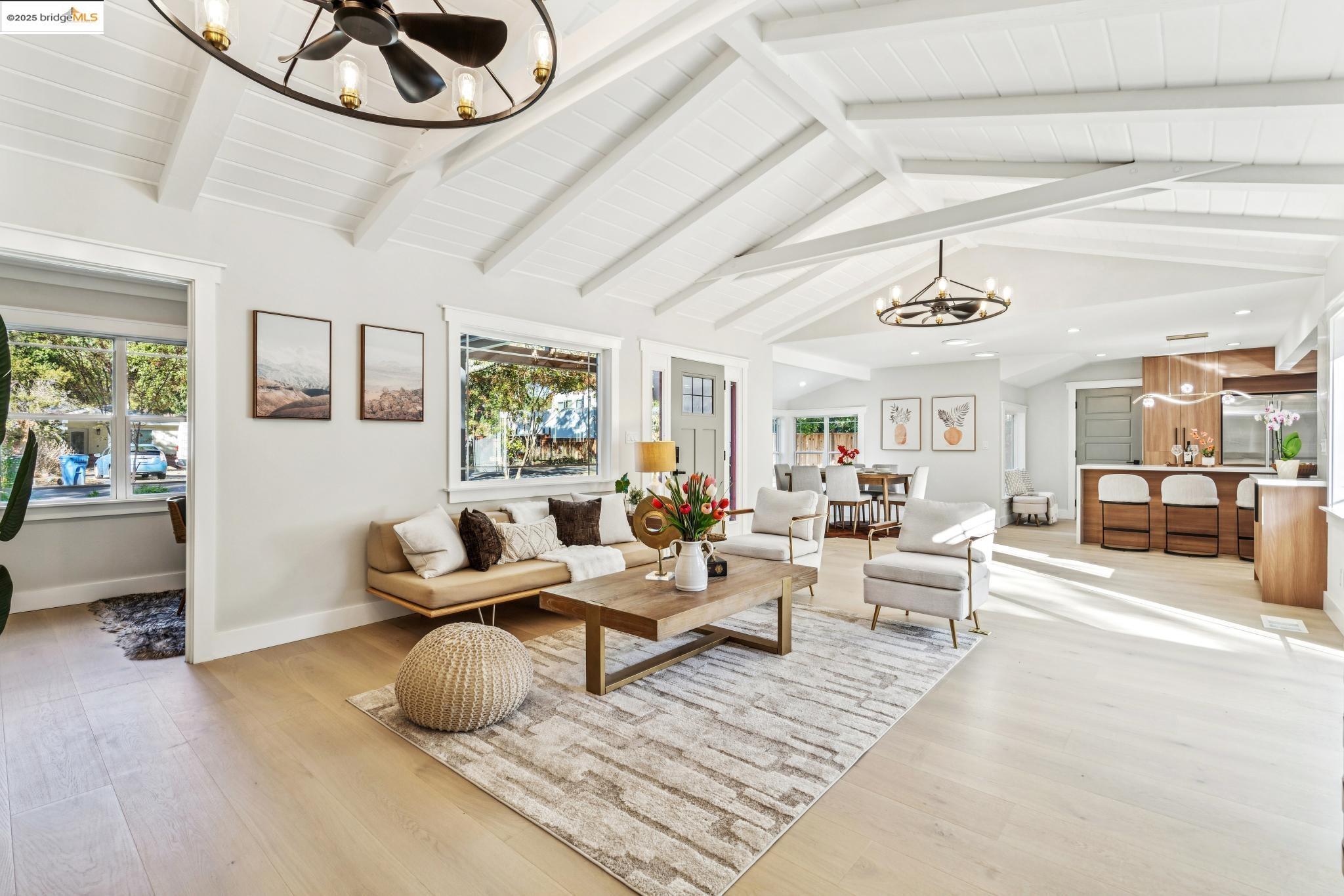 1333 Milton Avenue Walnut Creek, CA 94596 - Photo 9 of 59 a living room with furniture and a chandelier