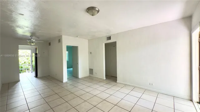 a view of an empty room and window