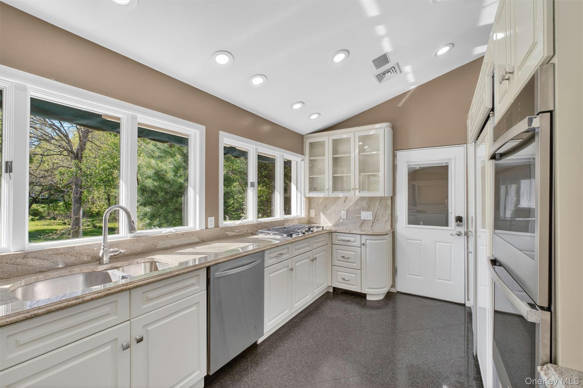 18 Millbank Road Poughkeepsie, NY 12603 - Photo 2 of 50 a large white kitchen with a large window