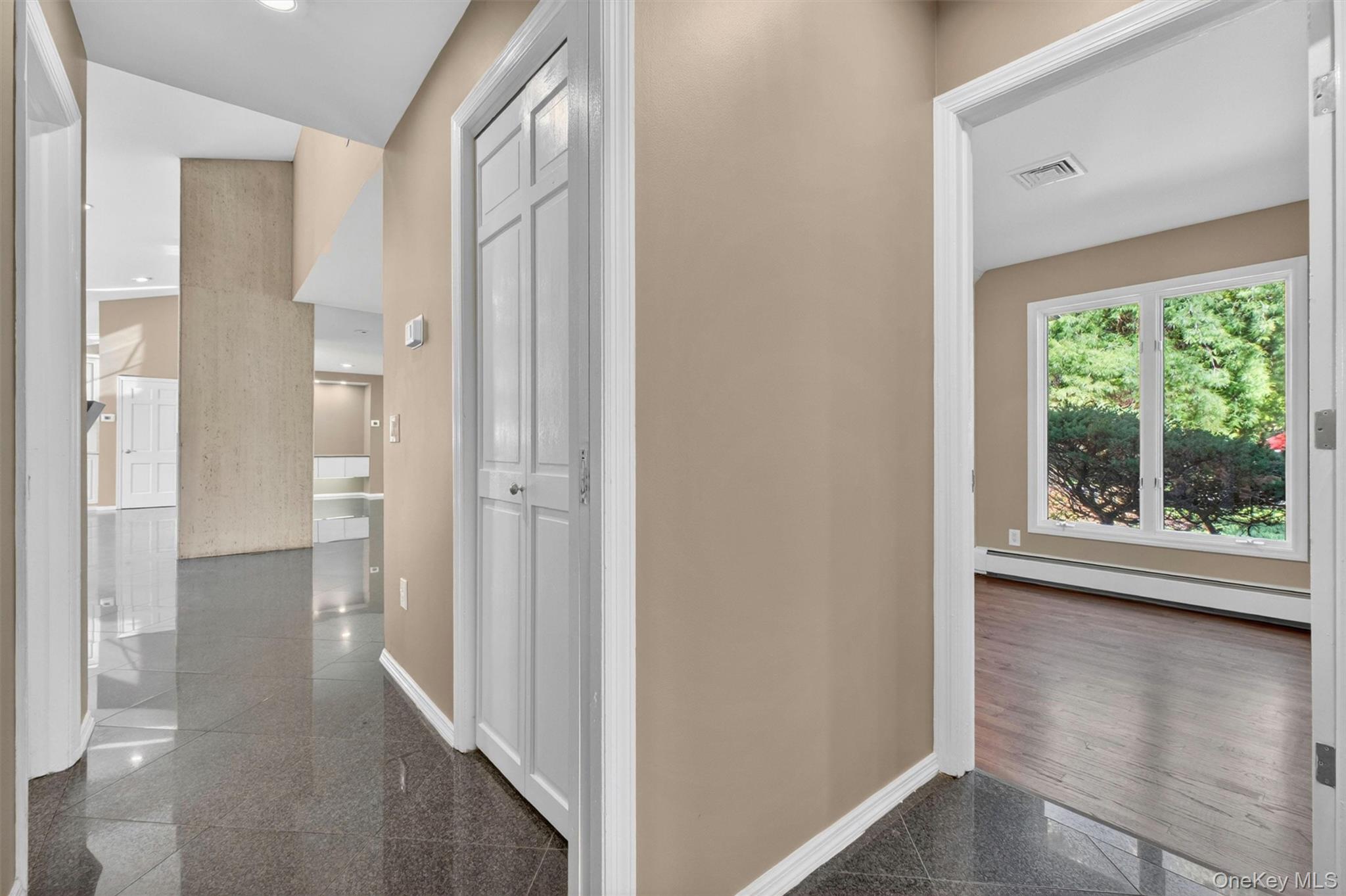 18 Millbank Road Poughkeepsie, NY 12603 - Photo 27 of 50 a view of hallway with a large window and wooden floor