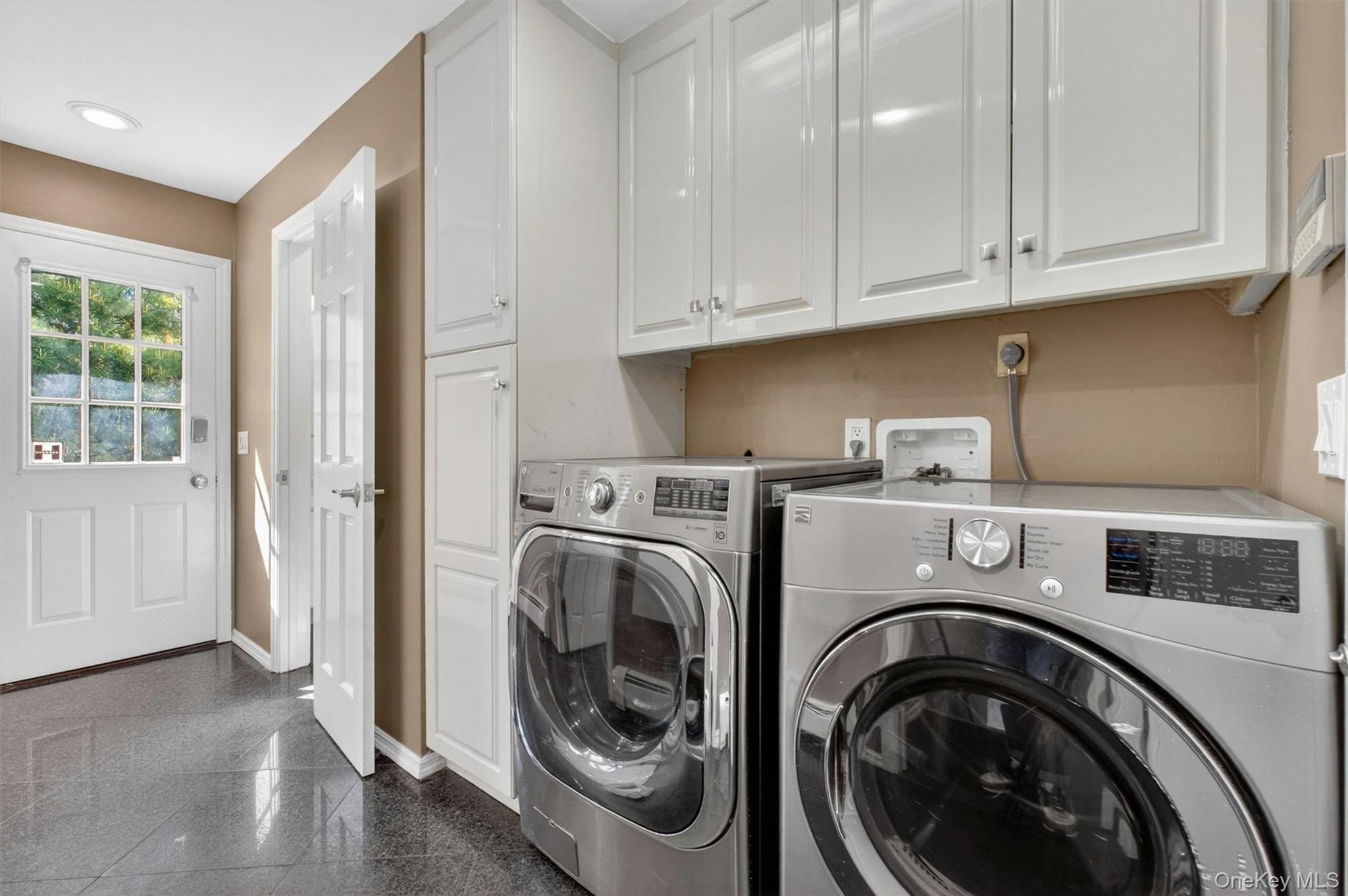 18 Millbank Road Poughkeepsie, NY 12603 - Photo 32 of 50 a utility room with sink dryer and washer