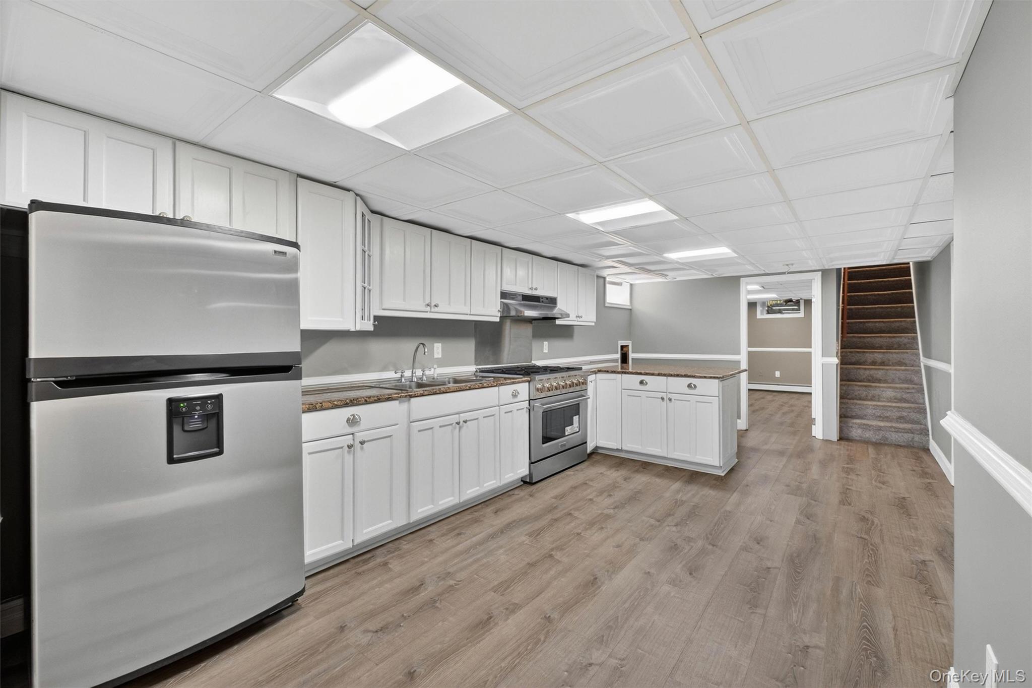 18 Millbank Road Poughkeepsie, NY 12603 - Photo 36 of 50 a kitchen with white cabinets and white appliances