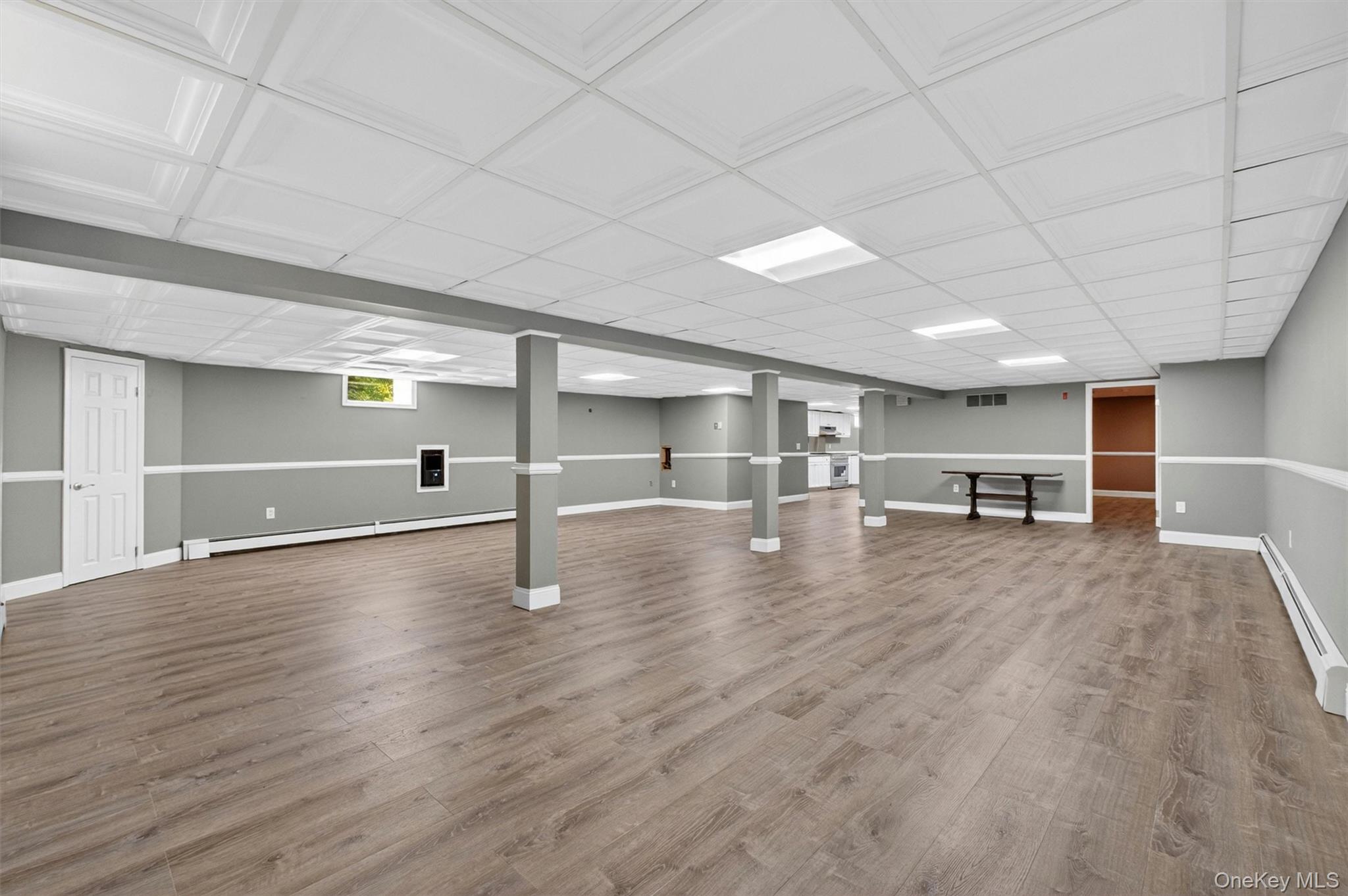 18 Millbank Road Poughkeepsie, NY 12603 - Photo 43 of 50 a view of an empty room with wooden floor and windows