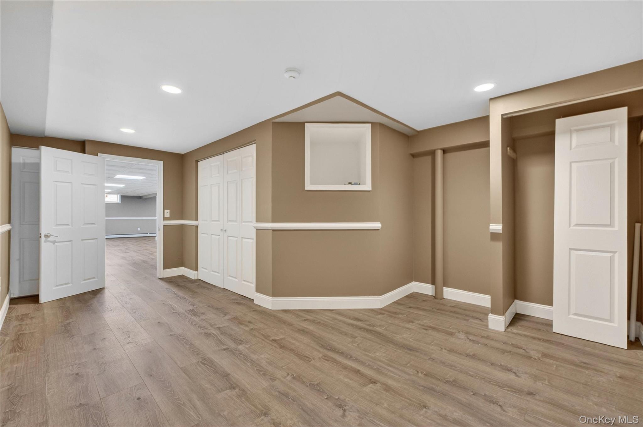 18 Millbank Road Poughkeepsie, NY 12603 - Photo 45 of 50 a view of an empty room with wooden floor and closet