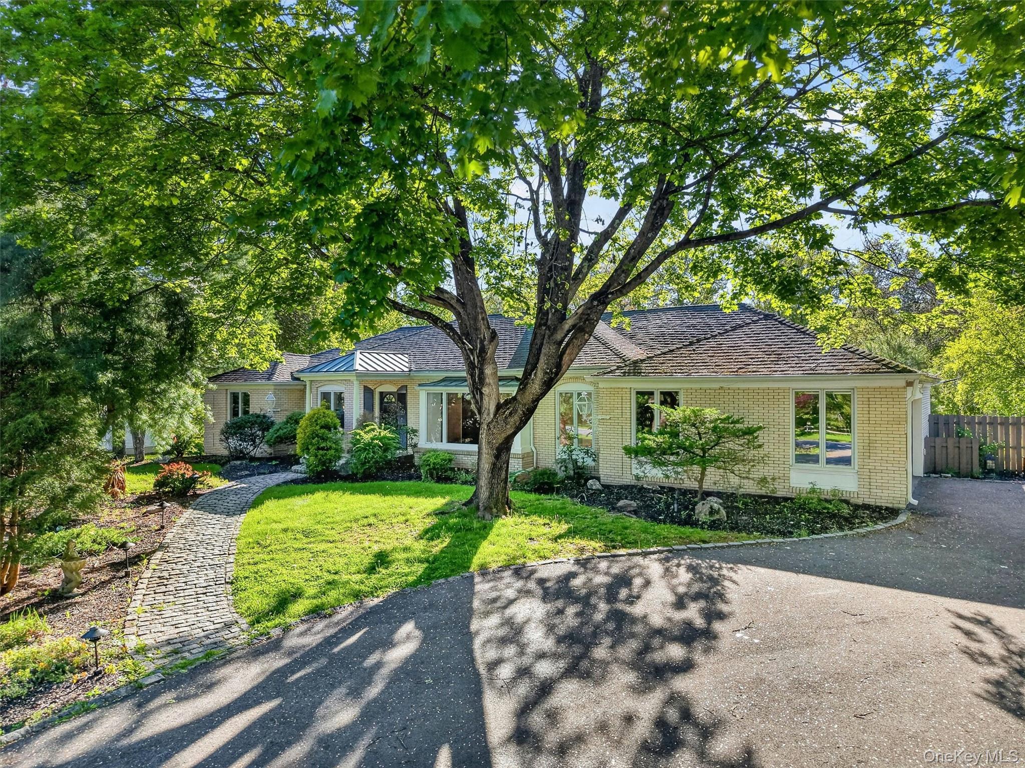 18 Millbank Road Poughkeepsie, NY 12603 - Photo 50 of 50 a front view of a house with a yard and a garden