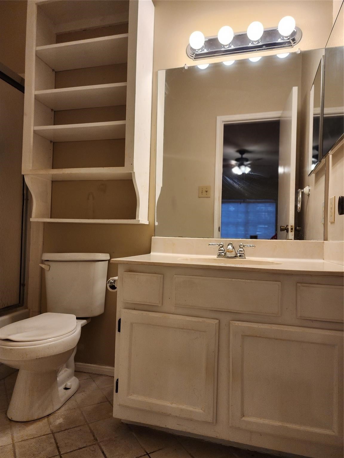 7399 Regency Square Court, Unit 7399 Houston, TX 77036 - Photo 15 of 27 a bathroom with a toilet and a sink
