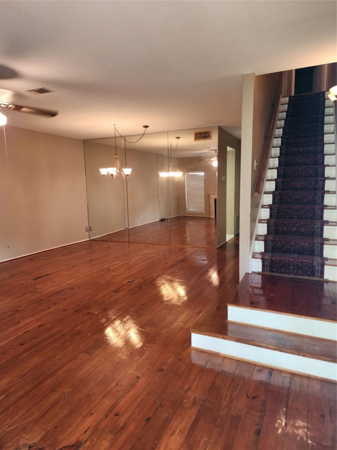 7399 Regency Square Court, Unit 7399 Houston, TX 77036 - Photo 2 of 27 a view of a hallway with wooden floor