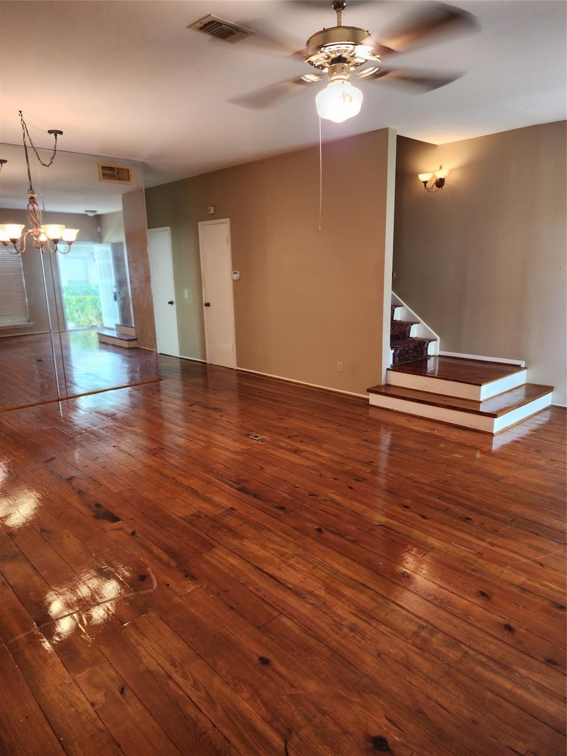 7399 Regency Square Court, Unit 7399 Houston, TX 77036 - Photo 4 of 27 a view of a room with wooden floor