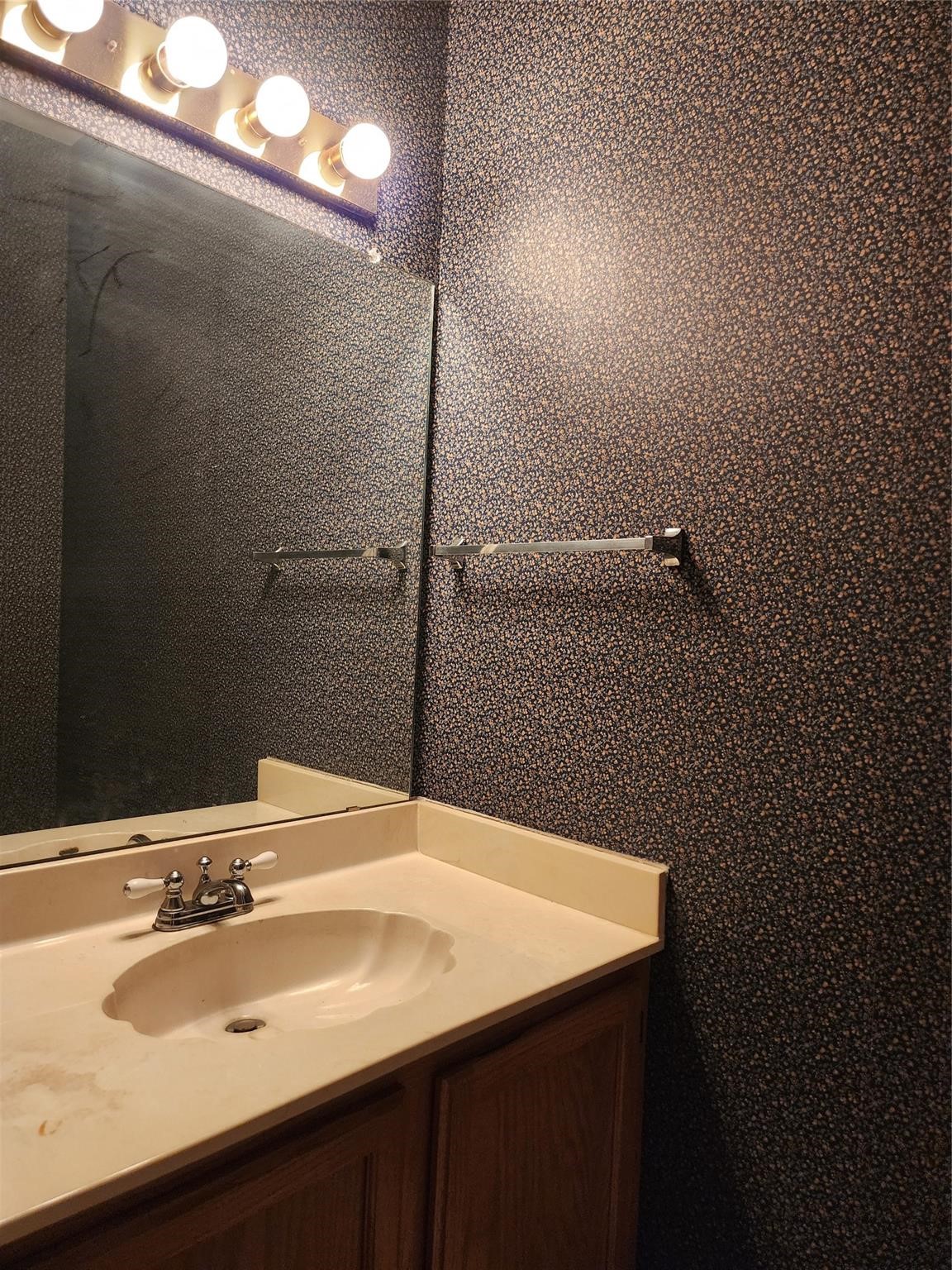 7399 Regency Square Court, Unit 7399 Houston, TX 77036 - Photo 8 of 27 a bathroom with a sink and a mirror