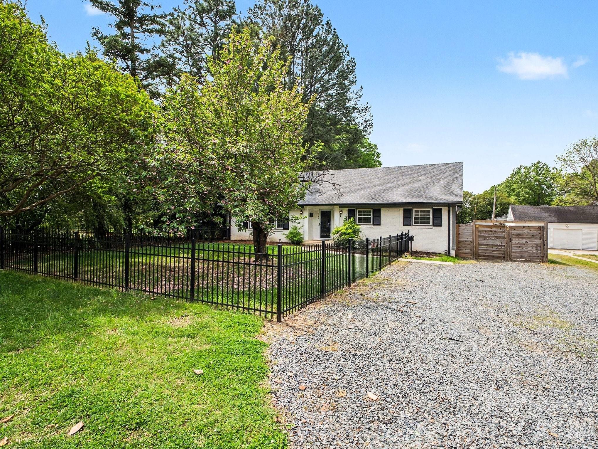 782 Union Street South Concord, NC 28025 - Photo 1 of 28 a view of a backyard with a garden