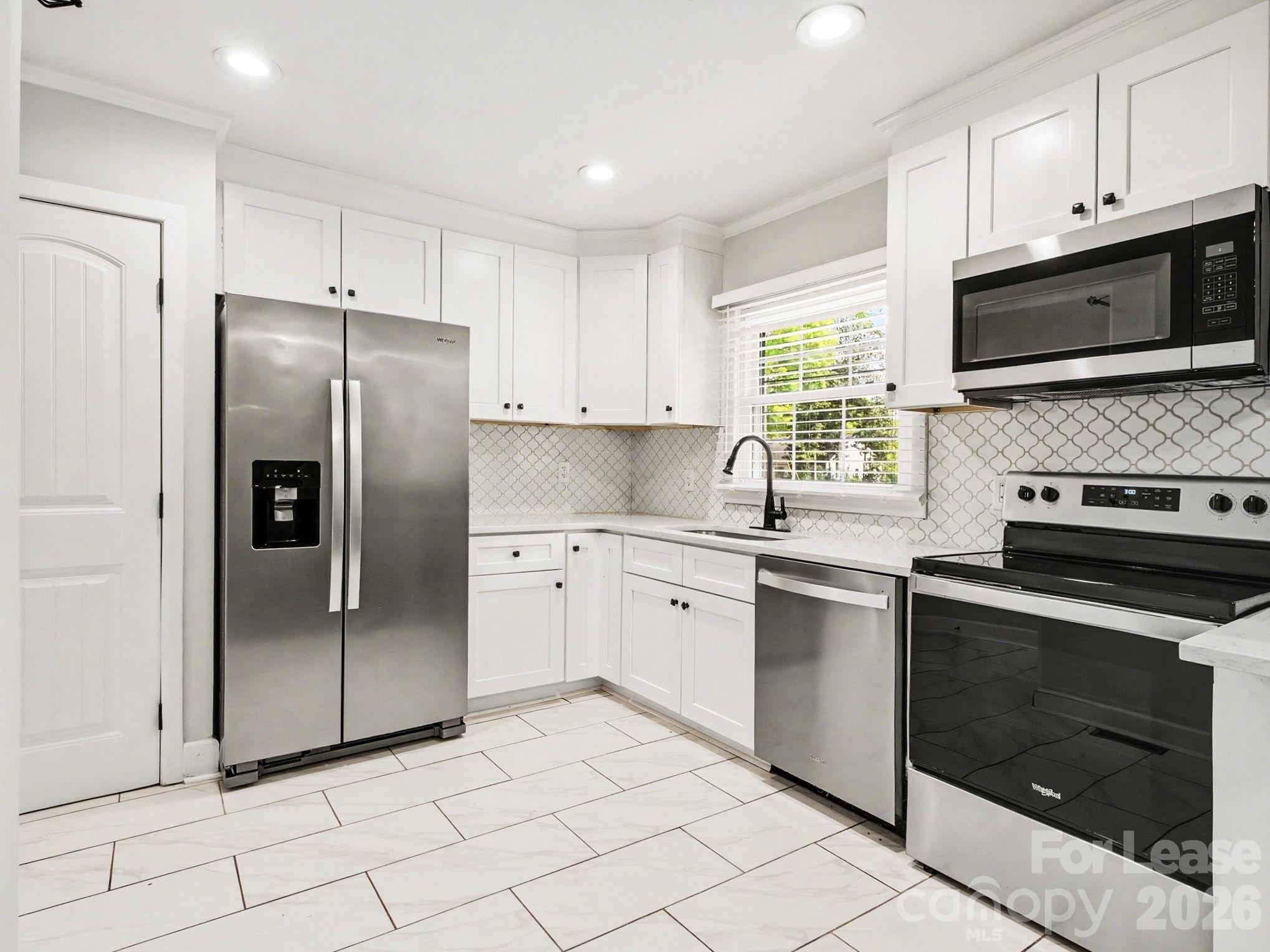782 Union Street South Concord, NC 28025 - Photo 11 of 28 a kitchen with cabinets stainless steel appliances and a window