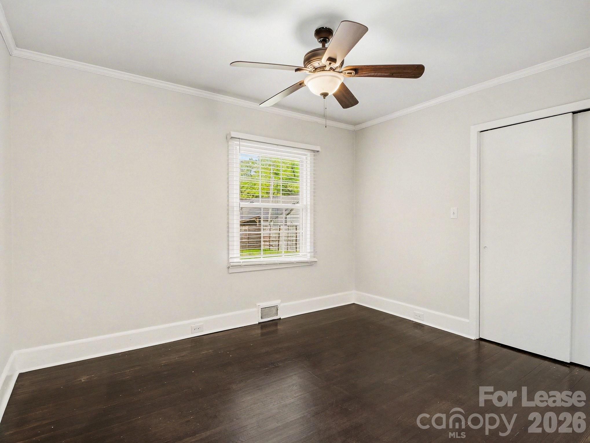 782 Union Street South Concord, NC 28025 - Photo 16 of 28 an empty room with wooden floor and windows