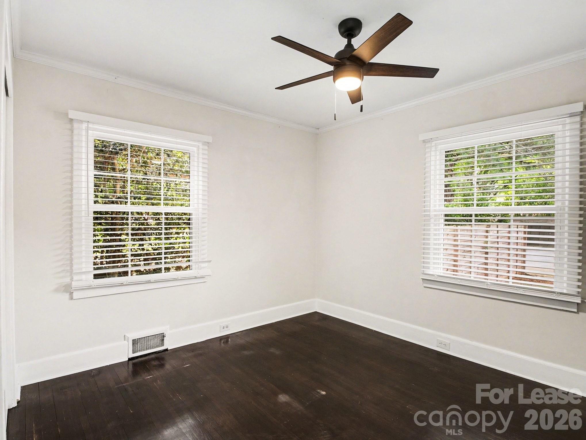 782 Union Street South Concord, NC 28025 - Photo 18 of 28 a view of an empty room with a window and wooden floor