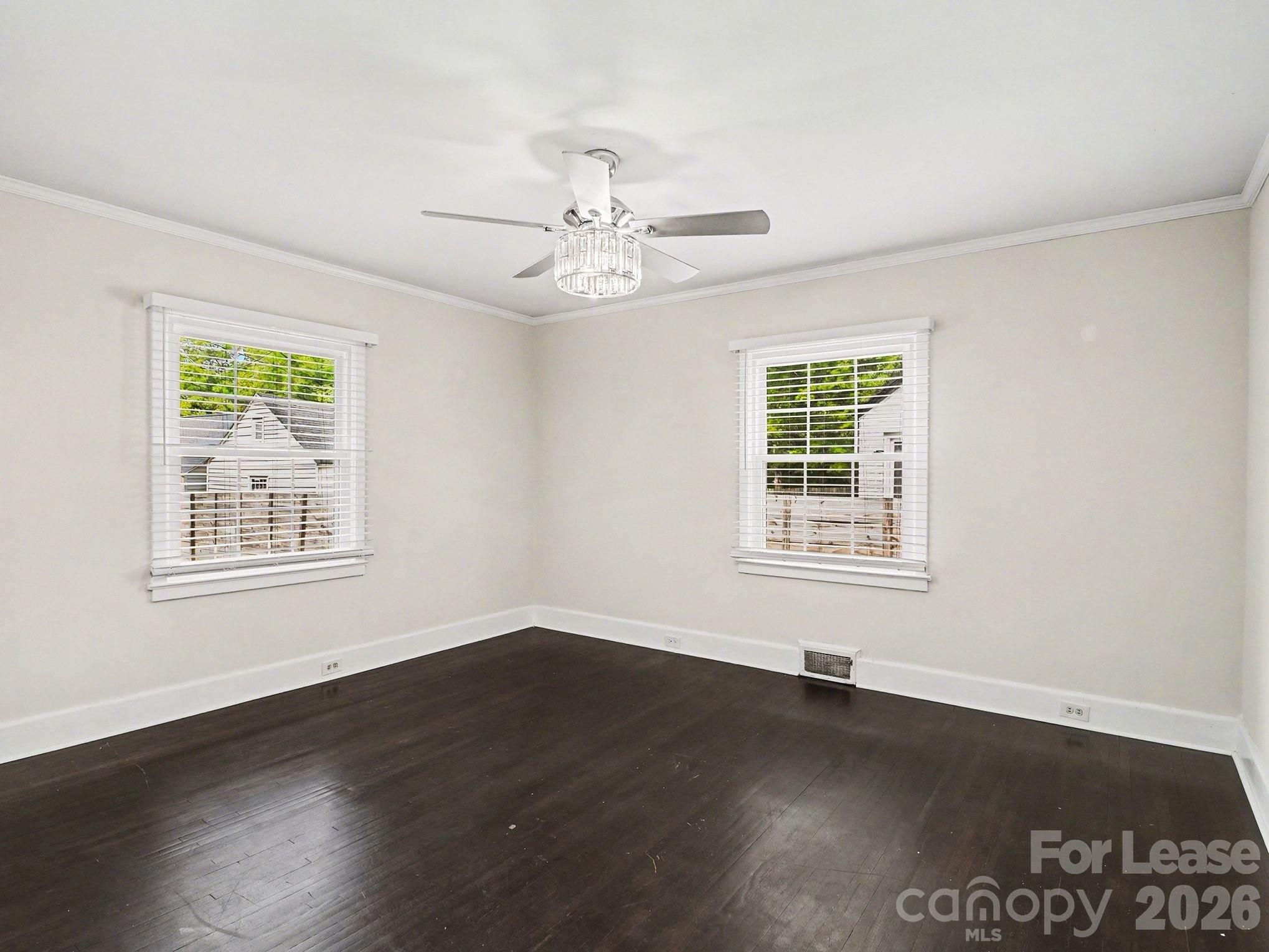 782 Union Street South Concord, NC 28025 - Photo 20 of 28 a view of an empty room with wooden floor and a window