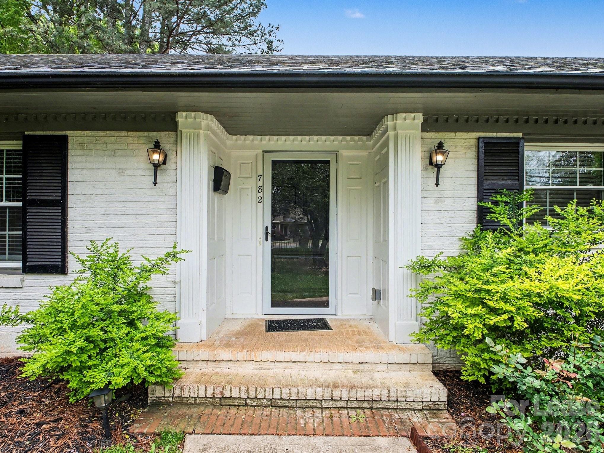 782 Union Street South Concord, NC 28025 - Photo 2 of 28 a front view of a house with a garden