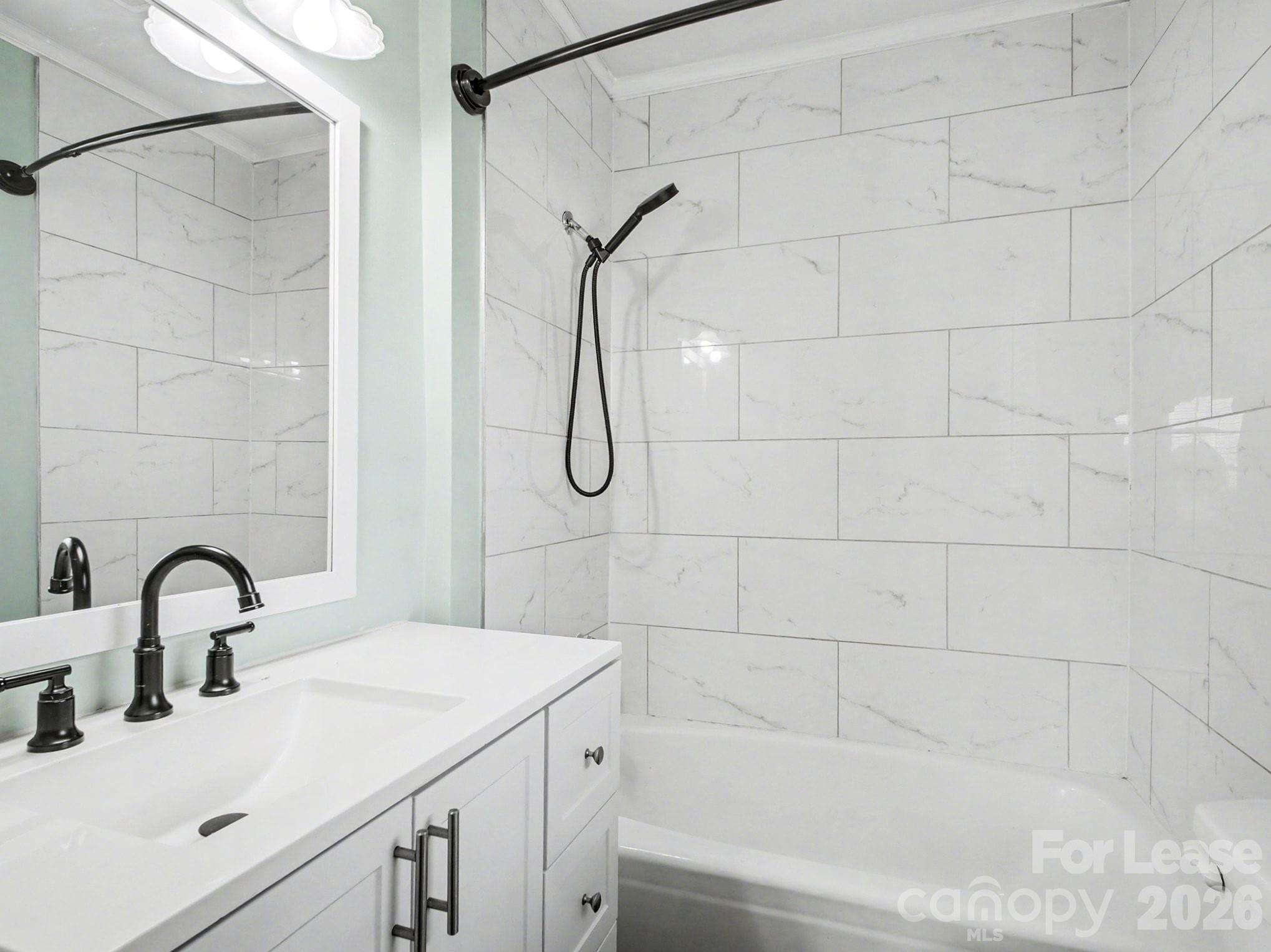 782 Union Street South Concord, NC 28025 - Photo 23 of 28 a bathroom with a sink and shower