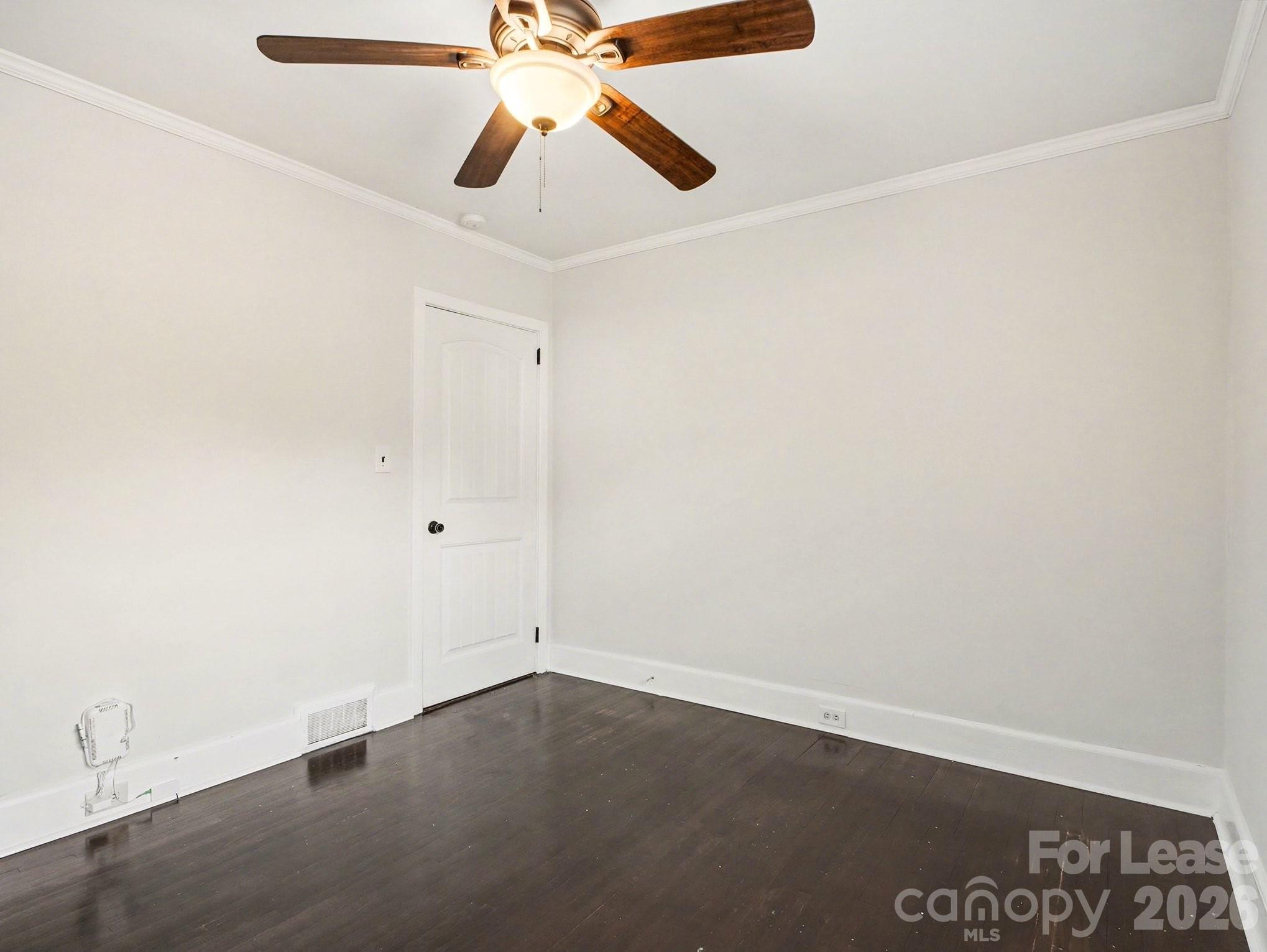 782 Union Street South Concord, NC 28025 - Photo 24 of 28 an empty room with a window and a fan