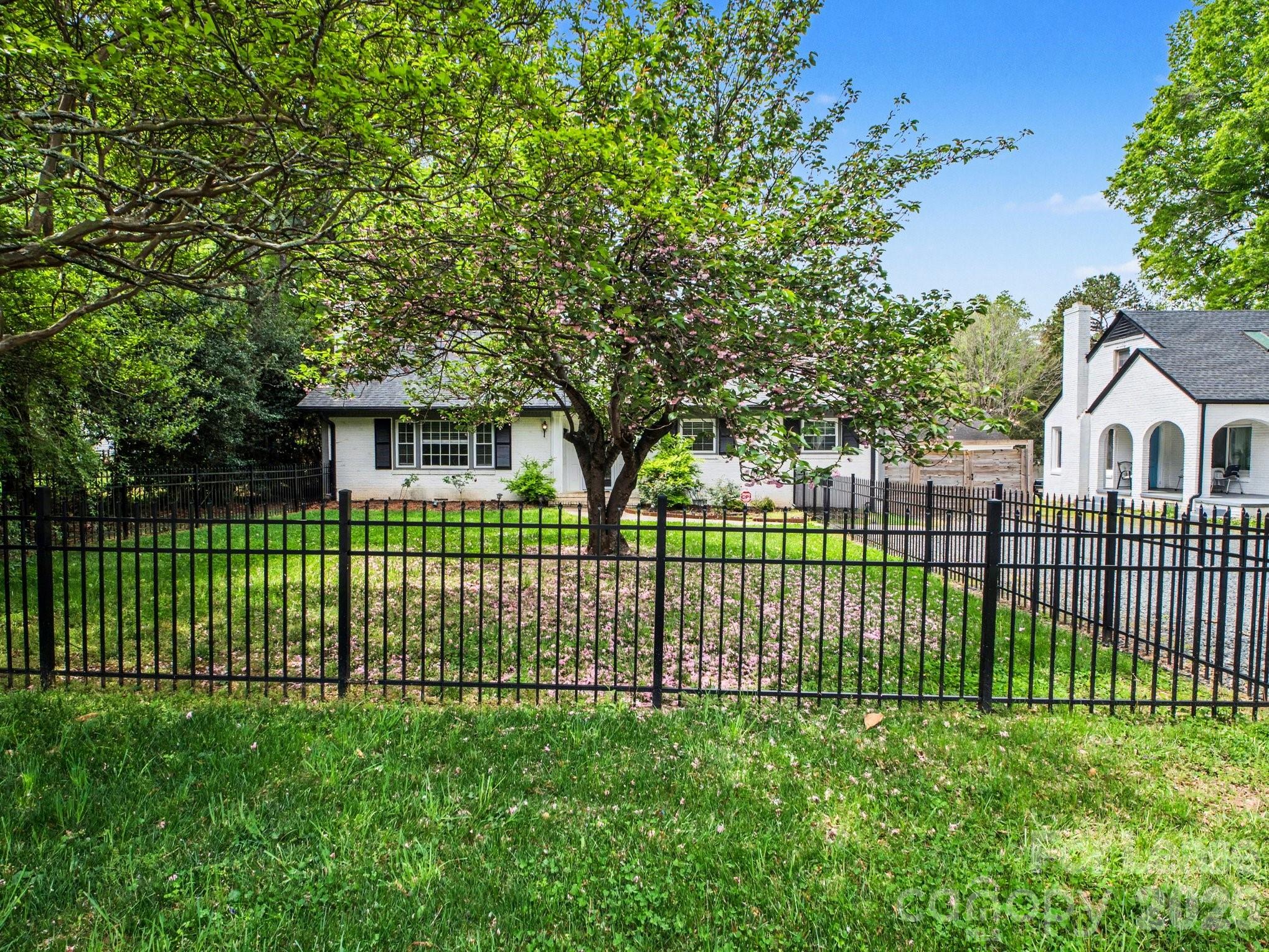 782 Union Street South Concord, NC 28025 - Photo 4 of 28 a view of a house with a small yard and wooden fence