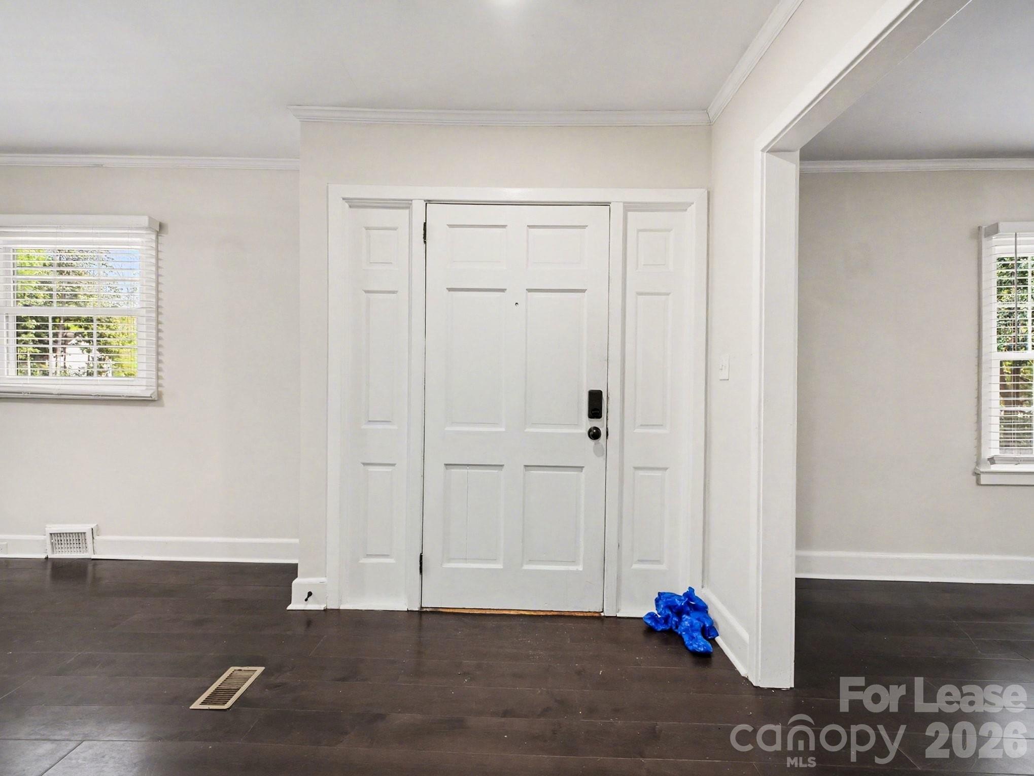 782 Union Street South Concord, NC 28025 - Photo 7 of 28 an empty room with wooden floor and windows