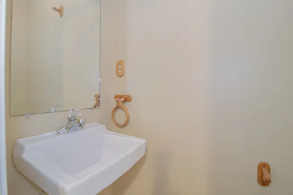 a bathroom with a sink and mirror