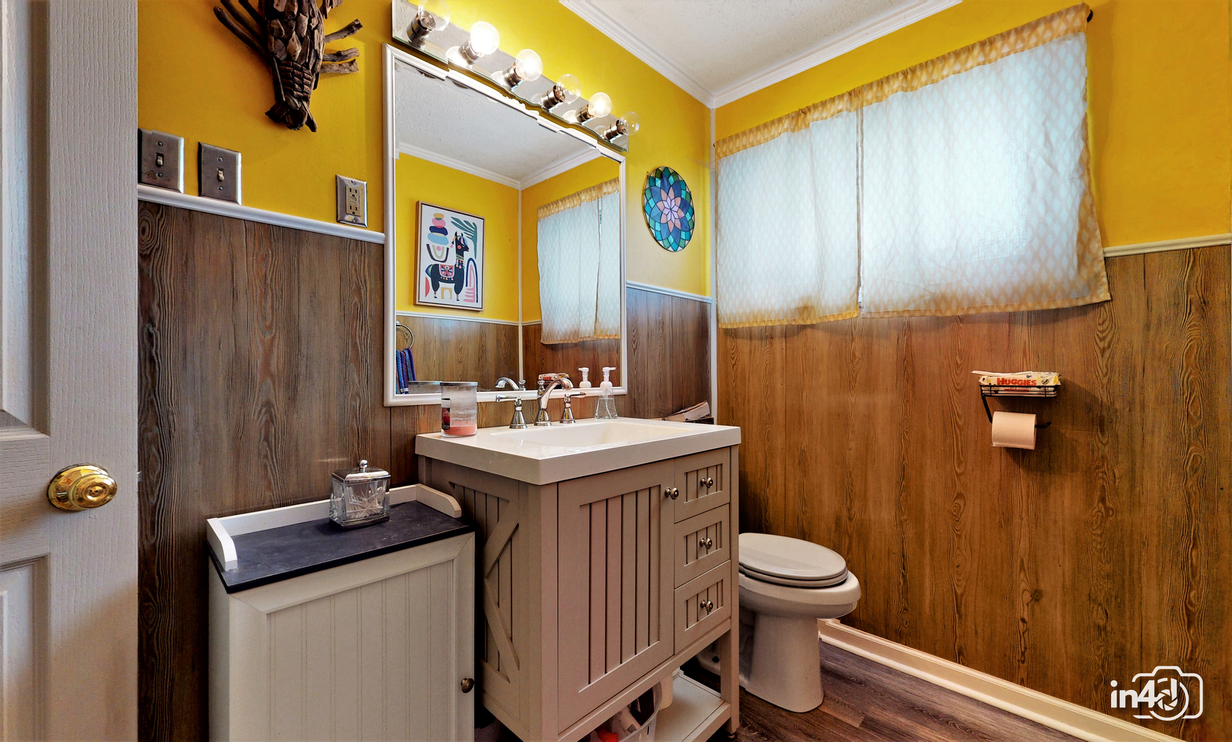 614 North Reed Street Joliet, IL 60435 - Photo 7 of 16 a bathroom with a sink a toilet and mirror