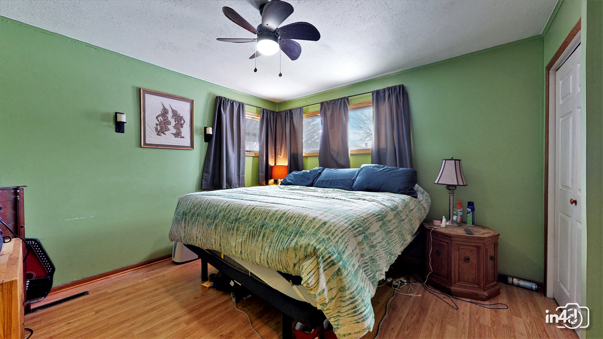614 North Reed Street Joliet, IL 60435 - Photo 9 of 16 a bedroom with a bed and wooden floor