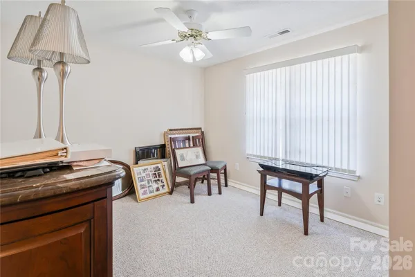a view of workspace with furniture and a window