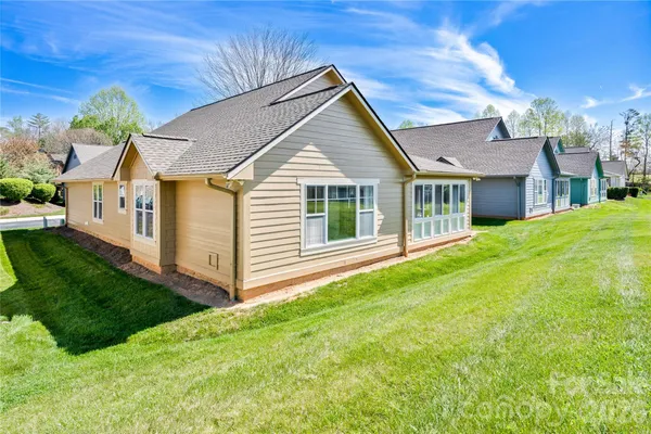 a view of a house with a yard
