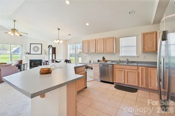 a kitchen with a sink a stove and cabinets