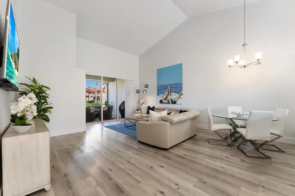 a living room with furniture and a potted plant
