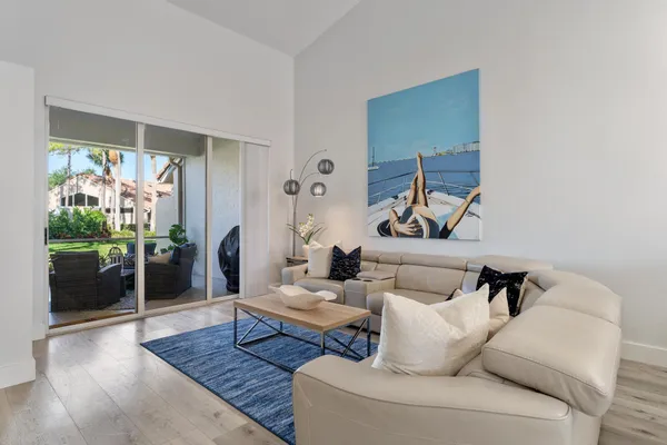 a living room with furniture and a rug