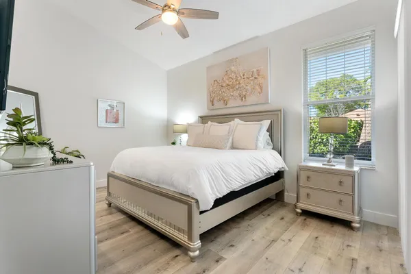 a bed room with a bed and a window