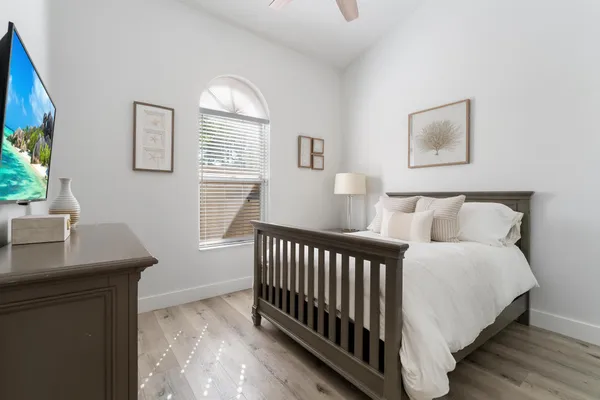 a bedroom with bed and a window