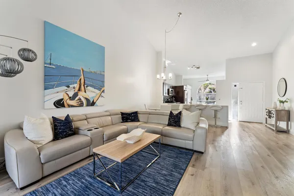 a living room with furniture or couch and a wooden floor