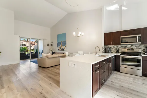 a kitchen with a stove and a microwave