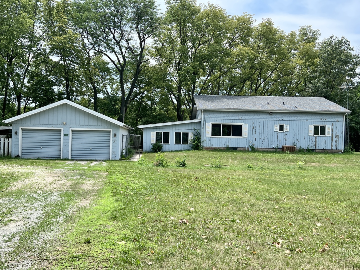 20747 Moline Road Lyndon, IL 61261 - Photo 1 of 32 a house with huge green field in front of it