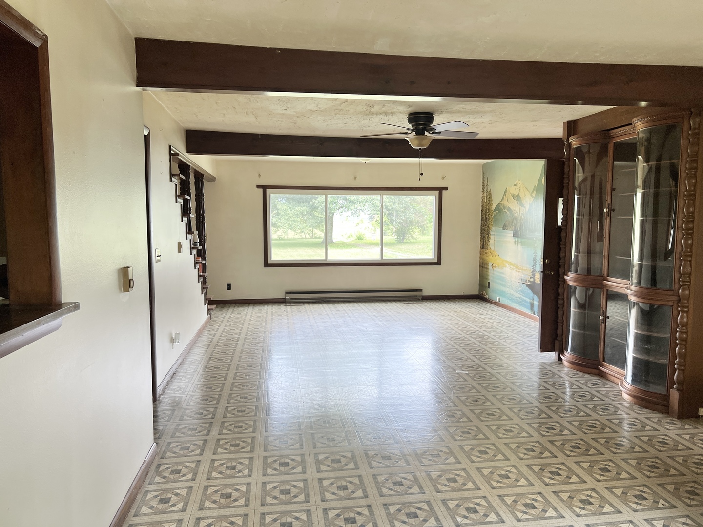 20747 Moline Road Lyndon, IL 61261 - Photo 16 of 32 a view of a hallway with wooden floor and a living room