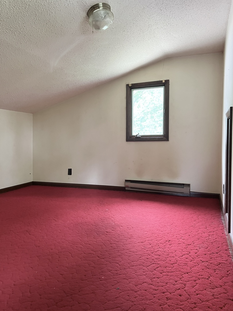 20747 Moline Road Lyndon, IL 61261 - Photo 24 of 32 an empty room with wooden floor and windows