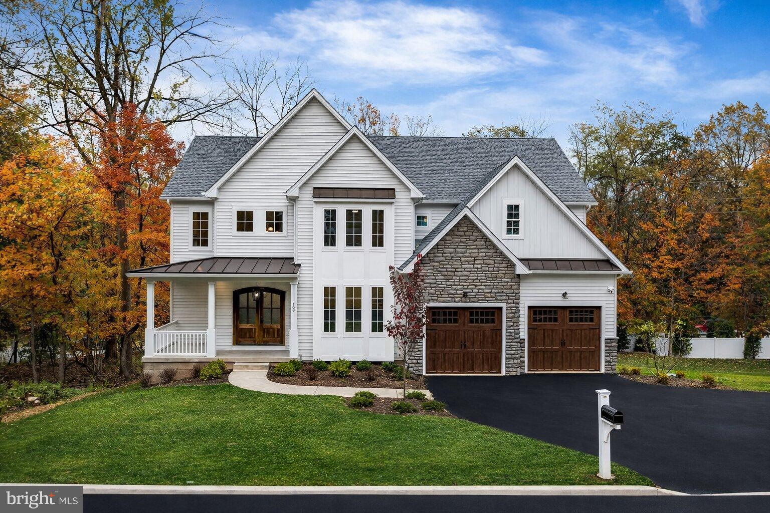 Charming home nestled in vibrant autumn hues.