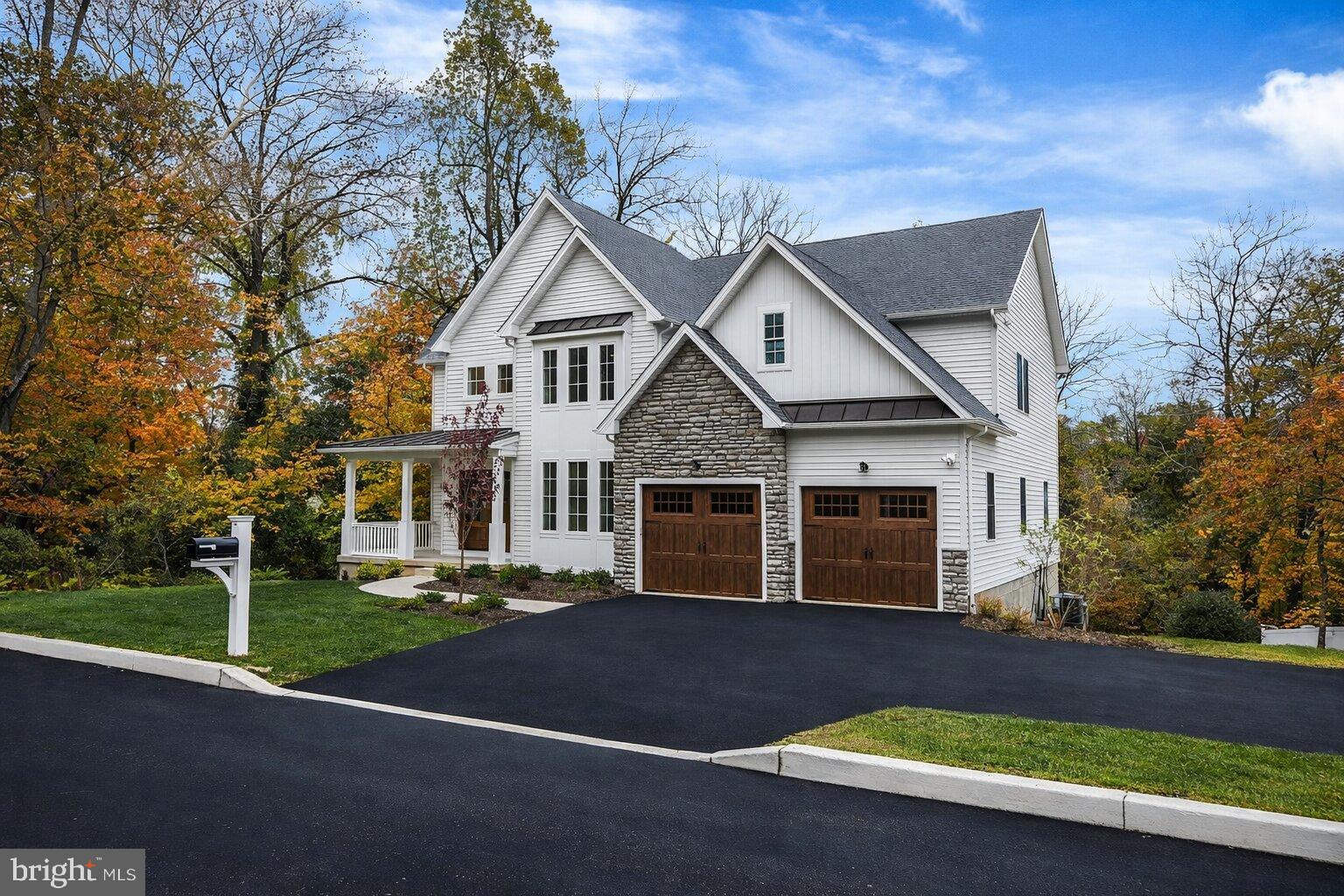 3 Walton Road Blue Bell, PA 19422 - Photo 2 of 46 Charming home nestled in vibrant autumn hues.