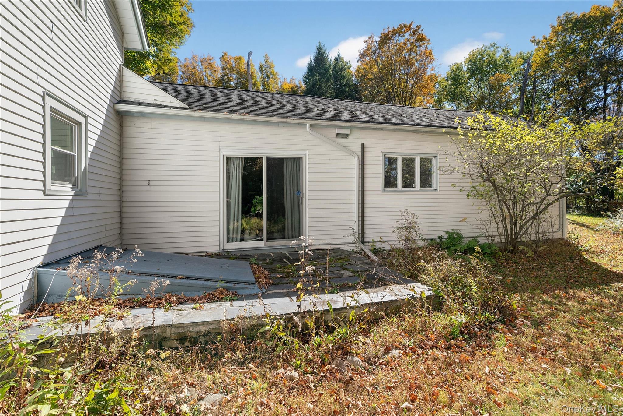 41 Whitlock Road Otisville, NY 10963 - Photo 43 of 48 Walk out from the dining room sliders to the yard. Note the bilco doors to the basement.