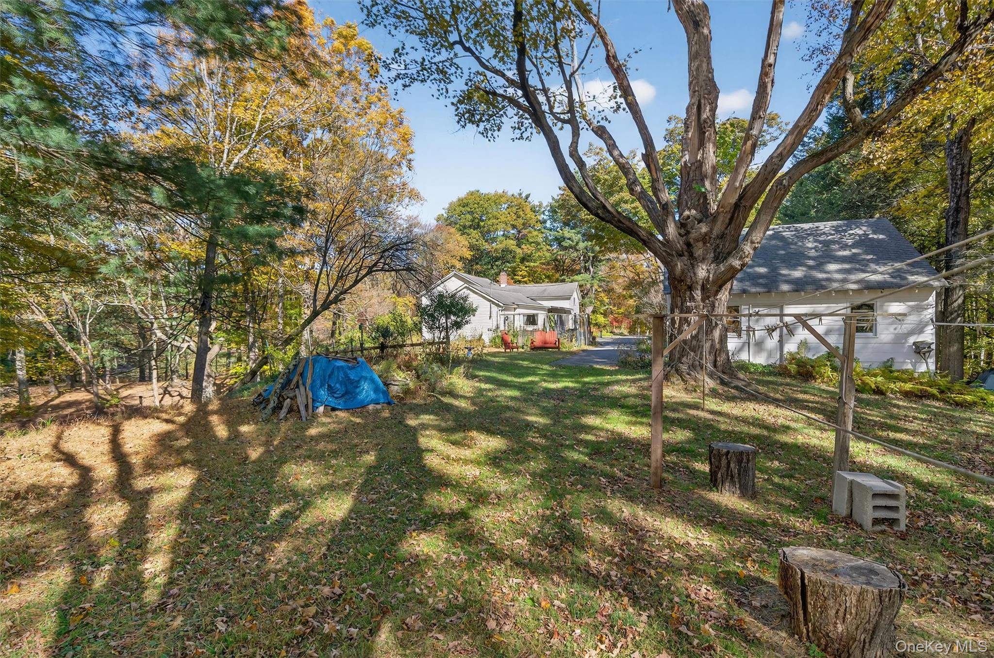 41 Whitlock Road Otisville, NY 10963 - Photo 45 of 48 Rear view of the detached garage and home from the lightly wooded backyard.