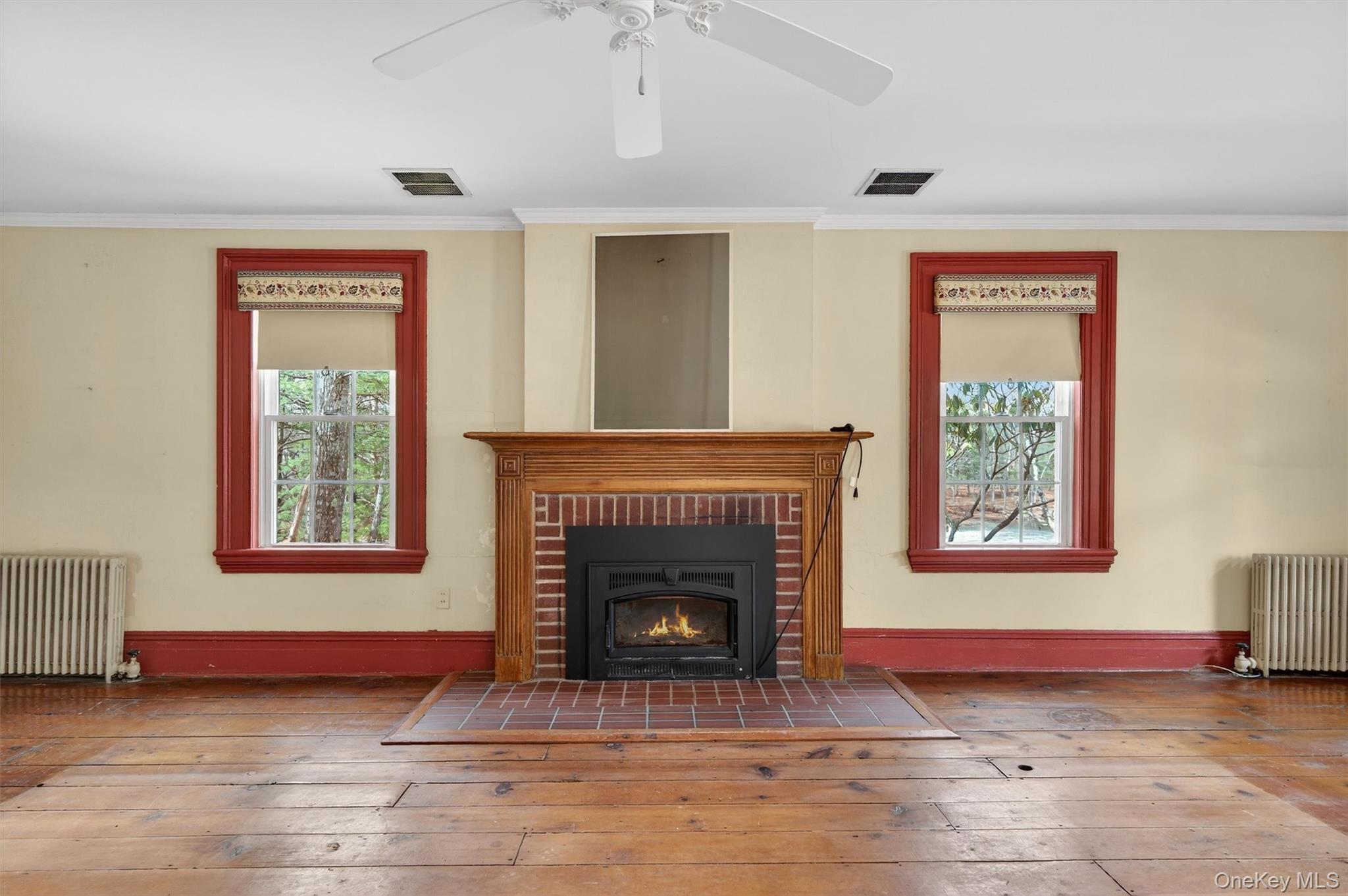 41 Whitlock Road Otisville, NY 10963 - Photo 6 of 48 Fireplace with brick surround and wood moldings is the focal point of the living room