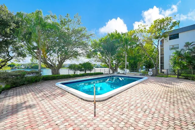 a view of a swimming pool with a patio