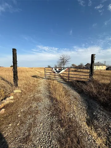 a view of a yard with an ocean view