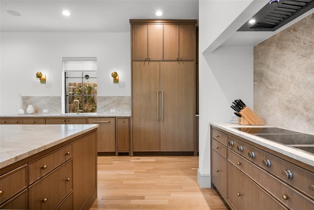 7158 Pasadena Avenue Dallas, TX 75214 - Photo 11 of 39 Kitchen with rift cut whoite oak cabinetry, built-in Thermador refrigerator, Gaganeau induction cooktop.