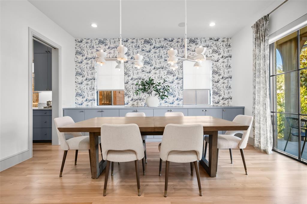 7158 Pasadena Avenue Dallas, TX 75214 - Photo 2 of 39 Dining space featuring a chandelier and light wood-type flooring