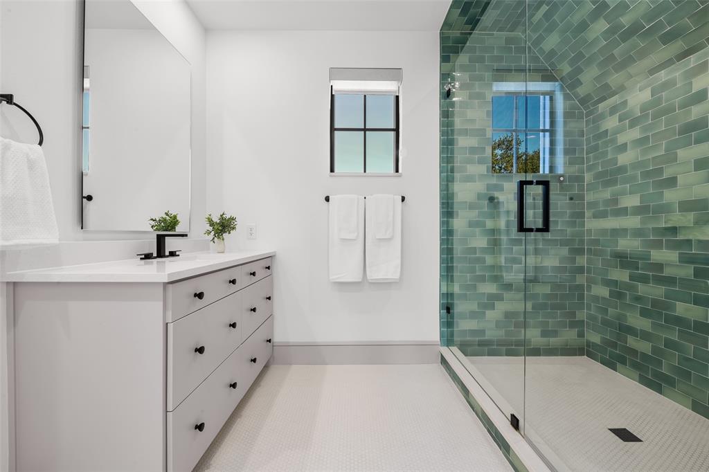 7158 Pasadena Avenue Dallas, TX 75214 - Photo 26 of 39 Full bathroom featuring a shower stall with designer tile