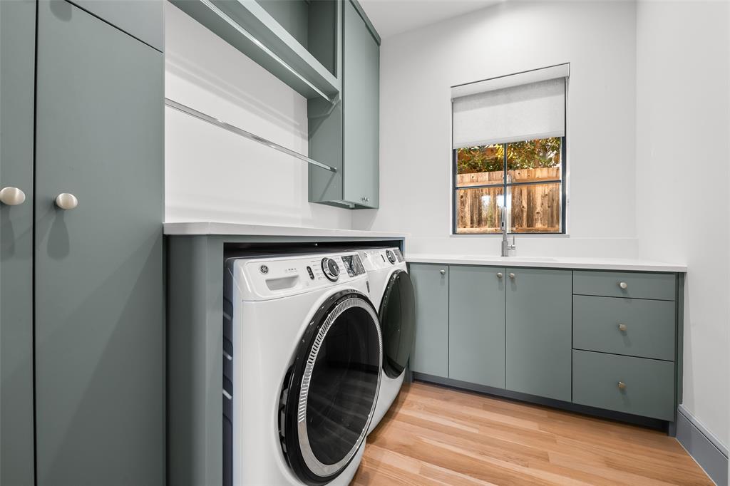 7158 Pasadena Avenue Dallas, TX 75214 - Photo 27 of 39 Laundry room with white oak hardwood floors, sink, custom storage cabinetry